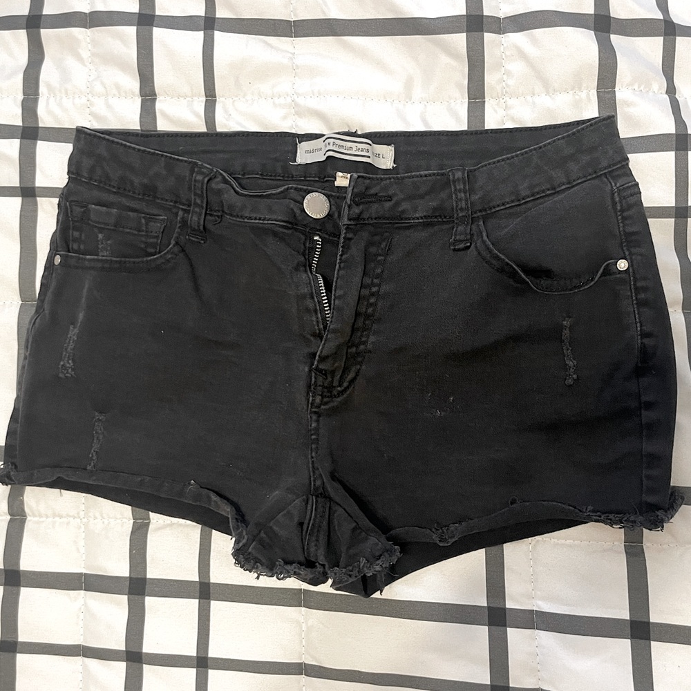 Mid rise black stretch jean shorts